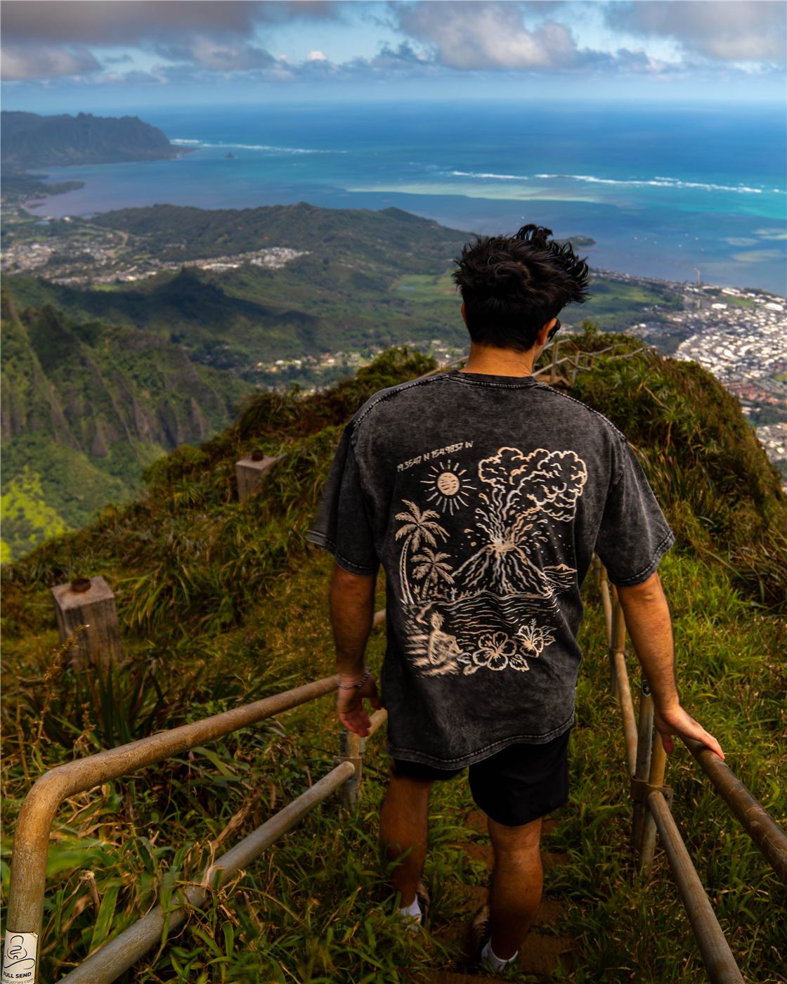 Wearing the Hawaii tee on a ridge trail above the ocean