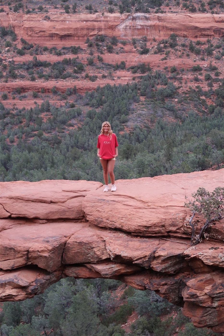 Standing on Devil's Bridge in Sedona wearing the Arizona tee